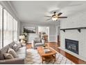 Living room with fireplace, hardwood floors, and comfy seating at 1117 Beechwood Dr, Rocky Mount, NC 27803