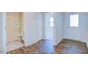 Clean bathroom with a tub shower, toilet and wood-look flooring at 1132 Middlecrest Dr, Rocky Mount, NC 27804