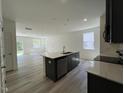 Stylish kitchen features a large island, modern cabinetry, and stainless steel appliances at 136 Parker Ln, Mebane, NC 27302