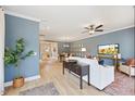 Spacious living room with blue walls, modern decor, and hardwood floors at 201 Broomgrove Way, Wake Forest, NC 27587