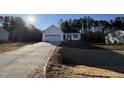 Two-car garage and driveway at 241 Magnolia Run Way, Benson, NC 27504
