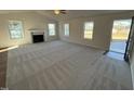 Spacious living room with fireplace and hardwood floors at 241 Magnolia Run Way, Benson, NC 27504