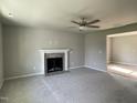 Spacious living room with fireplace and carpet flooring at 309 Starry Sky Dr, Benson, NC 27504