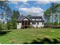 Lush backyard with a screened porch, perfect for relaxing and entertaining at 3923 Cedar Knolls Dr # 12, Youngsville, NC 27596
