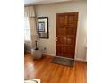 Hardwood floors and wood door entryway at 404 W Ninth St, Siler City, NC 27344