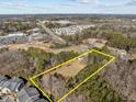 Aerial view of property showing large lot and surrounding area at 6516 Battle Bridge Rd, Raleigh, NC 27610