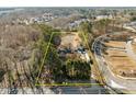 Aerial view showing house, detached garage, and large lot at 6516 Battle Bridge Rd, Raleigh, NC 27610