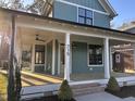 Beautiful home featuring a spacious, covered front porch perfect for relaxing at 715 Heidelberg St, Durham, NC 27704