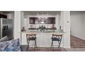 Kitchen features granite countertops and dark brown cabinets at 810 Brake St, Nashville, NC 27856
