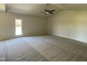Spacious living room with carpeted floor and ceiling fan at 83 Harvest Hills Ln, Dunn, NC 28334