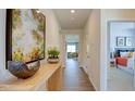 Bright hallway with wood-look floors, leading to other rooms at 1133 Middlecrest Dr, Rocky Mount, NC 27804