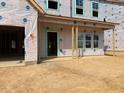 New home under construction features a covered porch and multiple windows for lots of natural light at 116 Black Walnut Dr # 203, Garner, NC 27529