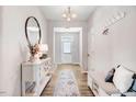 Bright and airy entryway with built-in bench, console table, and mirror at 142 Jade St, Smithfield, NC 27577