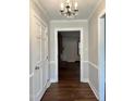 Inviting foyer with hardwood floors and decorative chandelier, leading to living spaces at 1641 Bridgedale Dr, Rocky Mount, NC 27803