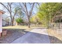 Large backyard with a shed and mature trees at 210 Earl St, Rocky Mount, NC 27804