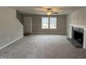 Spacious living room with fireplace and carpet at 262 Starry Sky Dr, Benson, NC 27504