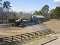 Aerial view of a horse stable with riding arena at 265 Verde Rd, Apex, NC 27523