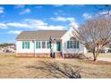 Ranch home with green shutters and a brick facade at 3901 La Varra Dr, Clayton, NC 27520