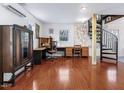 Spacious basement with hardwood floors, a spiral staircase, and a dedicated workspace at 497 Turn Key Way, Pittsboro, NC 27312