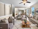 Virtually staged living room featuring neutral colored couches and a coffee table at 5023 Lalex Ln, Cary, NC 27519