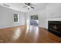 Spacious living room with hardwood floors and fireplace at 520 Matheson Pl, Cary, NC 27511