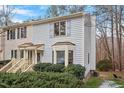 Townhome exterior showcasing light gray siding, and a deck at 6539 English Oaks Dr, Raleigh, NC 27615