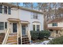 Front view of a townhome with gray siding and a wooden deck at 6539 English Oaks Dr, Raleigh, NC 27615