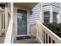 Front door entry with a gray door and nautical doormat at 6539 English Oaks Dr, Raleigh, NC 27615