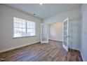 Home office with wood-look floors and a large window at 1108 Middlecrest Dr, Rocky Mount, NC 27804
