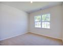 Bright bedroom with neutral walls, carpet flooring, and a large window at 1117 Middlecrest Dr, Rocky Mount, NC 27804