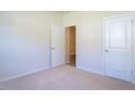 Spacious bedroom with neutral walls, carpet flooring, and two closets at 1117 Middlecrest Dr, Rocky Mount, NC 27804