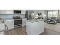 Modern kitchen featuring stainless steel appliances and an island at 141 Sunny Acres Rd, Raleigh, NC 27603