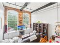Spacious living room with large windows, fireplace and built-ins at 1535 Caraleigh Mills Ct # 221, Raleigh, NC 27603