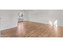 Hardwood floors and ample space for furniture in this well-lit bedroom at 1621 Sutton Dr, Raleigh, NC 27605
