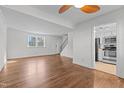 Bright and spacious living room with hardwood floors and a view of the kitchen at 1621 Sutton Dr, Raleigh, NC 27605