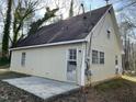 Rear view of home including patio, exterior siding, and windows at 2324 Lonnie Cir, Hillsborough, NC 27278