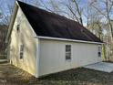 Side view of the home displaying siding, roof, and windows at 2324 Lonnie Cir, Hillsborough, NC 27278