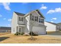 Two-story house, gray siding, attached garage, and landscaping at 326 Armistead Ct, Burlington, NC 27217