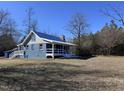 Newly renovated blue home with detached garage and large yard at 3612 Mt Zion Church Rd, Mebane, NC 27302