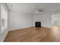 Inviting living room featuring light wood floors and a cozy fireplace, ready for your personal touch at 2332 Turtle Point Dr, Raleigh, NC 27604