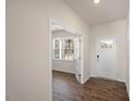 Bright entryway with hardwood floors and French doors leading to an office at 264 Hawksmoore Ln, Lillington, NC 27546