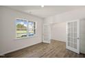Home office with hardwood floors and a window offering natural light at 264 Hawksmoore Ln, Lillington, NC 27546
