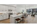 Modern kitchen with island and stainless steel appliances at 29 Enterprise St # 108, Raleigh, NC 27607