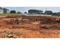 New home construction with foundation poured and framing started in a residential neighborhood at 41 South Faircox Way # 137, Garner, NC 27529