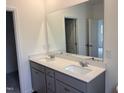Bathroom with double vanity and large mirror at 507 Barnes Landing Dr, Four Oaks, NC 27524