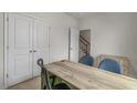 Home office with desk, chairs, and built-in shelving at 707 Lucky Clover Way, Fuquay Varina, NC 27526