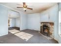Open floor plan with stone fireplace and view to the dining room at 1109 Mays Chapel Rd, Bear Creek, NC 27207