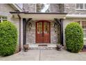 Elegant double front doors with stone accents at 1300 Caistor Ln, Raleigh, NC 27614