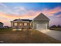 Charming single-Gathering home with a spacious front yard, covered porch and two car garage at 137 Glenwood Pl, Kenly, NC 27542