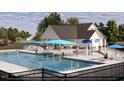 Resort-style pool with cabanas and a water feature at 182 Nimble Way # 220, Clayton, NC 27520